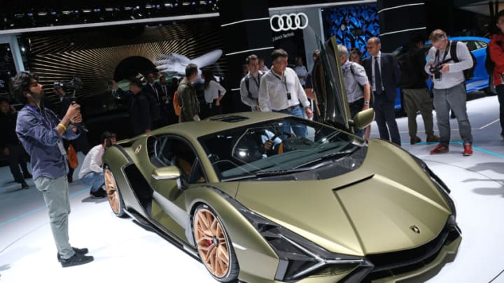 FRANKFURT AM MAIN, GERMANY - SEPTEMBER 11: Visitors look at the new Lamborghini Sian during the press days at the 2019 IAA Frankfurt Auto Show on September 11, 2019 in Frankfurt am Main, Germany. The IAA will be open to the public from September 12 through 22. (Photo by Sean Gallup/Getty Images)
