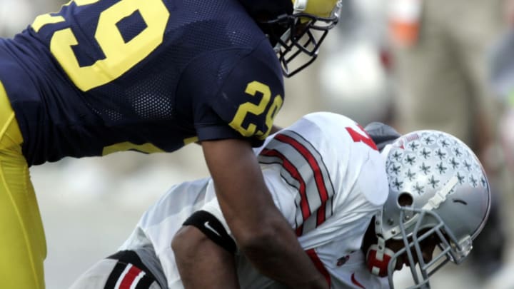 Ohio State University’s Ted Ginn Jr. #7 holds on to a fourh quarter pass with tight defence byUniversity of Michigan’s Leon Hall #29 at Michigan Stadium on November 19, 2005. Ohio State won the game 25-21. (Photo by Gregory Shamus/Getty Images)