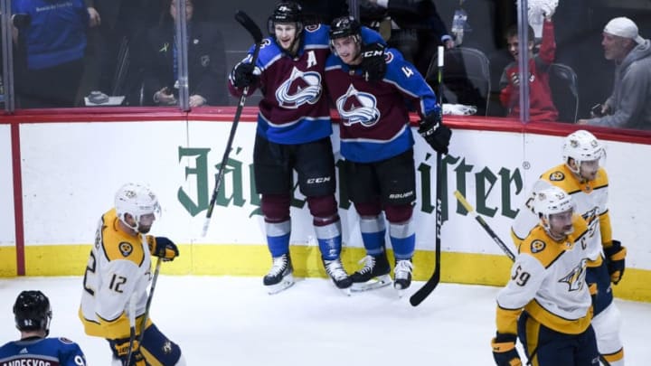 DENVER, CO - APRIL 16: Nathan MacKinnon (29) of the Colorado Avalanche celebrates his 3-0 goal with teammate Tyson Barrie (4) as Mike Fisher (12) of the Nashville Predators, Roman Josi (59) and Miikka Salomaki (20) react during the first period on Monday, April 16, 2018. The Colorado Avalanche hosted the Nashville Predators. (Photo by AAron Ontiveroz/The Denver Post via Getty Images)