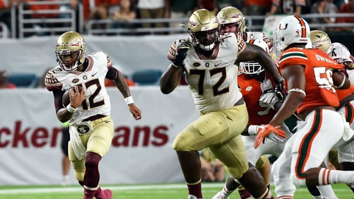 Oct 8, 2016; Miami Gardens, FL, USA; Florida State Seminoles quarterback Deondre Francois (12) carries the ball during the first half against Miami Hurricanes at Hard Rock Stadium. Mandatory Credit: Steve Mitchell-USA TODAY Sports