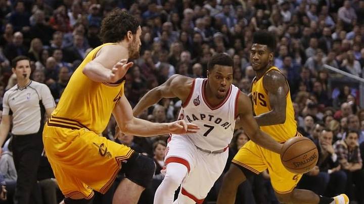 Feb 26, 2016; Toronto, Ontario, CAN; Toronto Raptors guard Kyle Lowry (7) dribbles the ball as Cleveland Cavaliers forward Kevin Love (0) and guard Iman Shumpert (4) defend at the Air Canada Centre. The Raptors won 99-97. Mandatory Credit: John E. Sokolowski-USA TODAY Sports