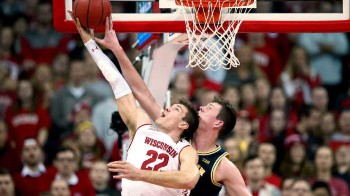 MADISON, WISCONSIN - JANUARY 19: Jon Teske #15 of the Michigan Wolverines blocks a shot attempt by Ethan Happ #22 of the Wisconsin Badgers in the first half at the Kohl Center on January 19, 2019 in Madison, Wisconsin. (Photo by Dylan Buell/Getty Images)