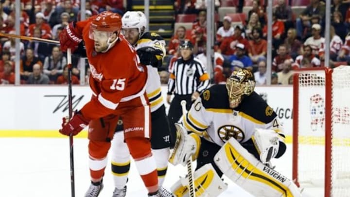 Oct 9, 2014; Detroit, MI, USA; Detroit Red Wings center Riley Sheahan (15) and Boston Bruins defenseman Kevan Miller (86) fight for position in front of goalie Tuukka Rask (40) in the third period at Joe Louis Arena. Detroit won 2-1. Mandatory Credit: Rick Osentoski-USA TODAY Sports