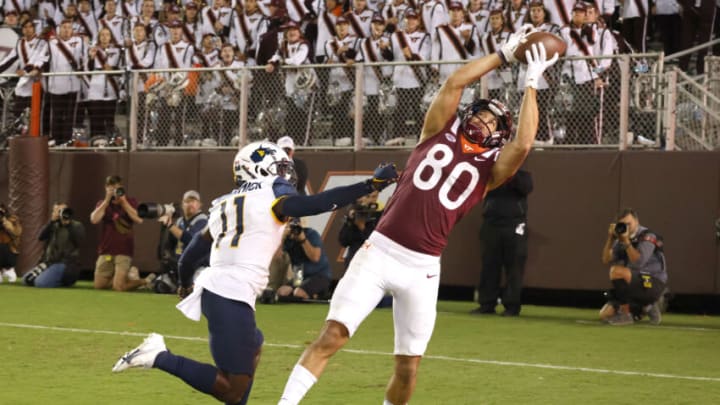 Sep 22, 2022; Blacksburg, Virginia, USA; Virginia Tech Hokies wide receiver Kaleb Smith (80) makes a touchdown catch over West Virginia Mountaineers cornerback Wesley McCormick (11) during the second quarter at Lane Stadium. Mandatory Credit: Reinhold Matay-USA TODAY Sports