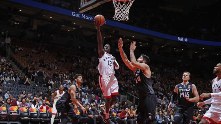 TORONTO, ON - OCTOBER 5: Deng Adel #12 of the Toronto Raptors drives to the basket against Melbourne United during a preseason game at Soctiabank Arena in Toronto, Ontario, Canada on October 5, 2018. NOTE TO USER: User expressly acknowledges and agrees that, by downloading and/or using this photograph, user is consenting to the terms and conditions of the Getty Images License Agreement. Mandatory Copyright Notice: Copyright 2018 NBAE (Photo by Mark Blinch/NBAE via Getty Images)