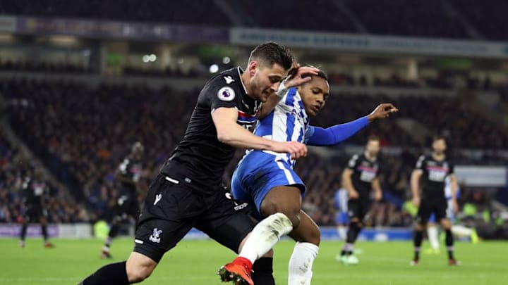BRIGHTON, ENGLAND - NOVEMBER 28: Joel Ward of Crystal Palace tackles Jose Izquierdo of Brighton