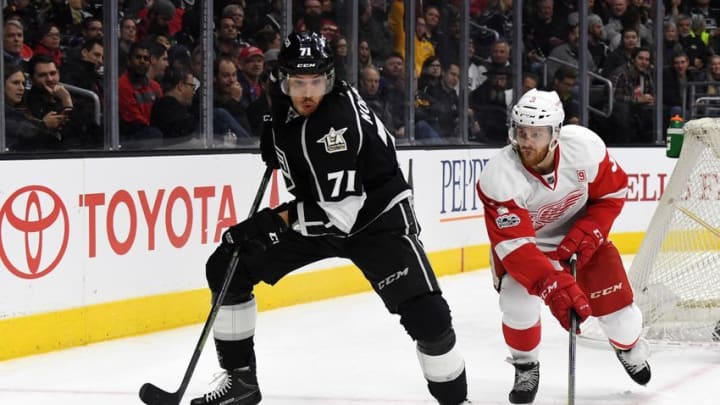 Jan 5, 2017; Los Angeles, CA, USA; Los Angeles Kings center Jordan Nolan (71) and Detroit Red Wings defenseman Nick Jensen (3) battle for the puck in the second period during a NHL hockey game at Staples Center. Mandatory Credit: Kirby Lee-USA TODAY Sports