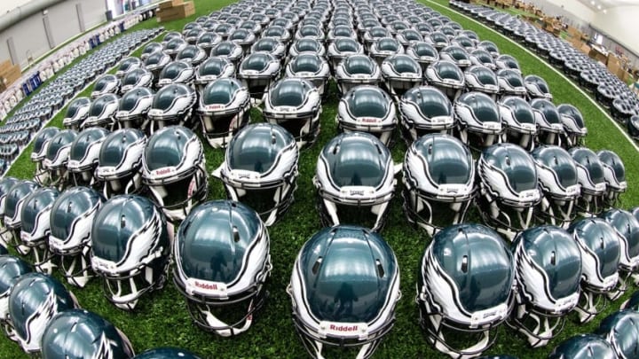 May 24, 2016; Philadelphia, PA, USA; Philadelphia Eagles helmets lined up on the indoor turf during OTA