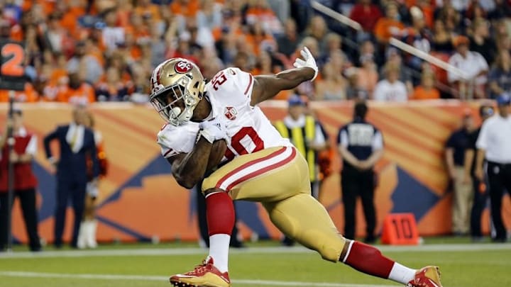 Aug 20, 2016; Denver, CO, USA; San Francisco 49ers running back Carlos Hyde (28) scores a touchdown against the Denver Broncos during the second quarter at Sports Authority Field at Mile High. Mandatory Credit: Troy Babbitt-USA TODAY Sports