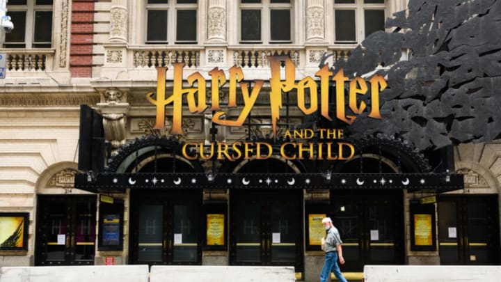 NEW YORK, NEW YORK - AUGUST 02: A person walks outside the Harry Potter and the Cursed Child play at Lyric Theatre as the city continues Phase 4 of re-opening following restrictions imposed to slow the spread of coronavirus on August 2, 2020 in New York City. The fourth phase allows outdoor arts and entertainment, sporting events without fans and media production. (Photo by Noam Galai/Getty Images)