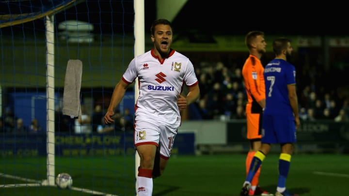 KINGSTON UPON THAMES, ENGLAND – SEPTEMBER 22: Ryan Seager of MK Dons celebrates after scoring his sides first goal during the Sky Bet League One match between A.F.C. Wimbledon and Milton Keynes Dons at The Cherry Red Records Stadium on September 22, 2017 in Kingston upon Thames, England. (Photo by Alex Pantling/Getty Images)