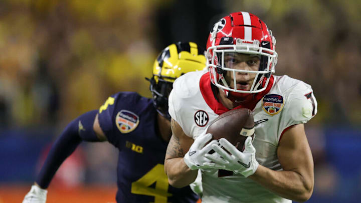 Dec 31, 2021; Miami Gardens, Florida, USA; Georgia Bulldogs wide receiver Jermaine Burton (7) catches a pass for a touchdown ahead of Michigan Wolverines defensive back Vincent Gray (4) in the second quarter during the Orange Bowl college football CFP national semifinal game at Hard Rock Stadium. Mandatory Credit: Sam Navarro-USA TODAY Sports