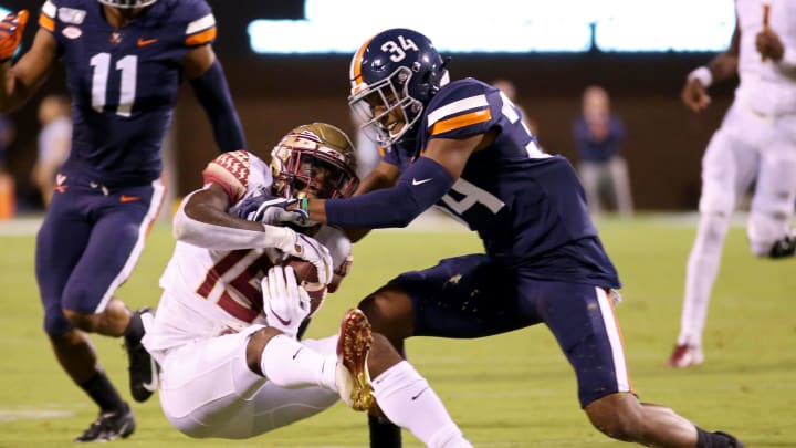 Bryce Hall #34 of the Virginia Cavaliers breaks up a pass (Photo by Ryan M. Kelly/Getty Images)