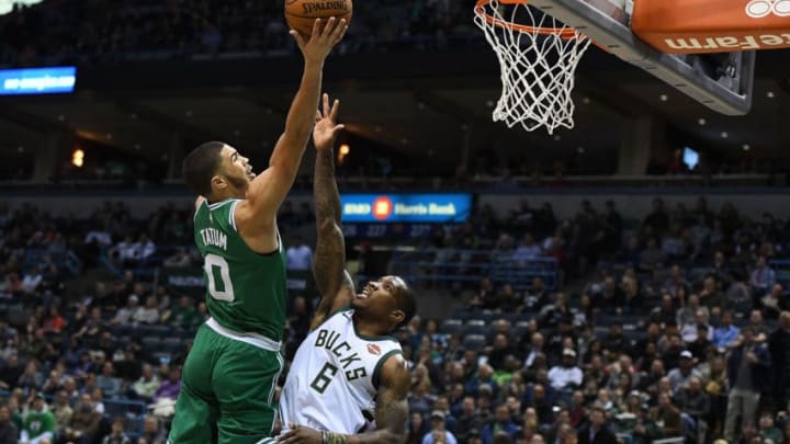 MILWAUKEE, WI - APRIL 03: Jayson Tatum #0 of the Boston Celtics goes up for a shot over Eric Bledsoe #6 of the Milwaukee Bucks during the first half of a game at the Bradley Center on April 3, 2018 in Milwaukee, Wisconsin. NOTE TO USER: User expressly acknowledges and agrees that, by downloading and or using this photograph, User is consenting to the terms and conditions of the Getty Images License Agreement. (Photo by Stacy Revere/Getty Images)