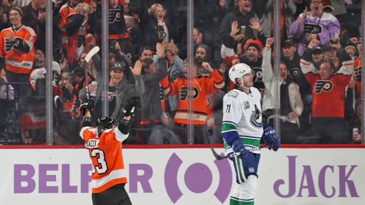 PHILADELPHIA, PA - NOVEMBER 25: Jakub Voracek #93 of the Philadelphia Flyers celebrates his third period goal against Zack MacEwen #71 of the Vancouver Canucks while on his knees on November 25, 2019 at the Wells Fargo Center in Philadelphia, Pennsylvania. (Photo by Len Redkoles/NHLI via Getty Images)
