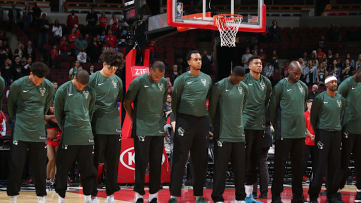 CHICAGO, IL - OCTOBER 6: John Henson #31 and Giannis Antetokounmpo #34 of the Milwaukee Bucks with their teammates stand for the National Anthem before the preseason game against the Chicago Bulls on October 6, 2017 at the United Center in Chicago, Illinois. NOTE TO USER: User expressly acknowledges and agrees that, by downloading and or using this Photograph, user is consenting to the terms and conditions of the Getty Images License Agreement. Mandatory Copyright Notice: Copyright 2017 NBAE (Photo by Gary Dineen/NBAE via Getty Images)