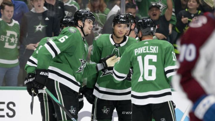 Oct 3, 2023; Dallas, Texas, USA; Dallas Stars defenseman Lian Bichsel (6) and left wing Jason Robertson (21) and center Joe Pavelski (16) celebrates a goal scored by Robertson against the Colorado Avalanche during the second period at the American Airlines Center. Mandatory Credit: Jerome Miron-USA TODAY Sports