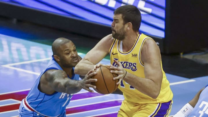 Houston Rockets forward P.J. Tucker (left) battles for the ball with Los Angeles Lakers center Marc Gasol (right)(Troy Taormina-USA TODAY Sports)