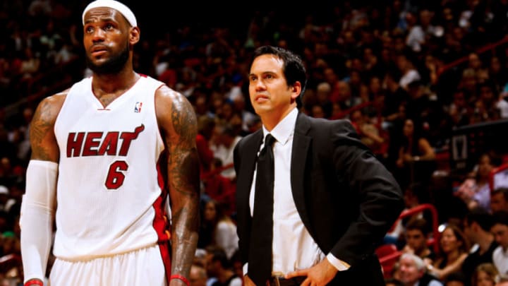 MIAMI, FL - MARCH 10: Erik Spoelstra, head coach of the Miami Heat, speaks to player LeBron James #6 during a game against the Indiana Pacers on March 10, 2012 at American Airlines Arena in Miami, Florida. NOTE TO USER: User expressly acknowledges and agrees that, by downloading and/or using this Photograph, User is consenting to the terms and conditions of the Getty Images License Agreement. Mandatory copyright notice: Copyright NBAE 2012 (Photo by Issac Baldizon/NBAE via Getty Images)