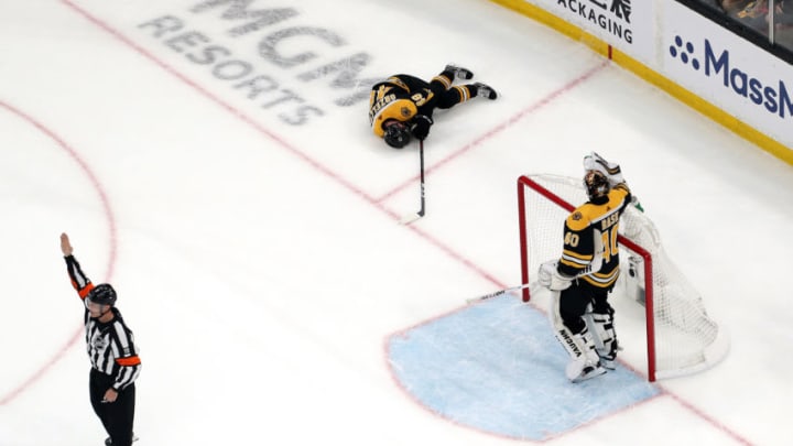 BOSTON, MASSACHUSETTS - MAY 29: Matt Grzelcyk #48 of the Boston Bruins lays on the ice after being hit into the boards by Oskar Sundqvist (not pictured) #70 of the St. Louis Blues during the first period in Game Two of the 2019 NHL Stanley Cup Final at TD Garden on May 29, 2019 in Boston, Massachusetts. (Photo by Patrick Smith/Getty Images)