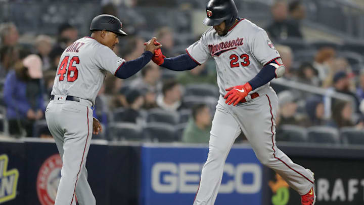 NEW YORK, NEW YORK - MAY 03: Nelson Cruz #23 of the Minnesota Twins celebrates his two run home run with third base coach Tony Diaz #46 in the eighth inning against the New York Yankees at Yankee Stadium on May 03, 2019 in the Bronx borough of New York City. (Photo by Elsa/Getty Images)