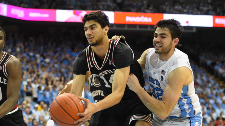 Feb 22, 2017; Chapel Hill, NC, USA; Louisville Cardinals forward Anas Mahmoud (14) and North Carolina Tar Heels forward Luke Maye (32) fight for the ball in the second half. The Tar Heels defeated the Cardinals 74-63 at Dean E. Smith Center. Mandatory Credit: Bob Donnan-USA TODAY Sports