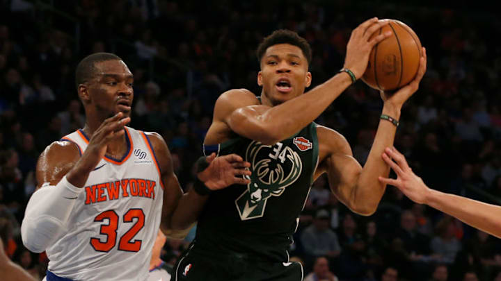 NEW YORK, NY - DECEMBER 01: (NEW YORK DAILIES OUT) Giannis Antetokounmpo #34 of the Milwaukee Bucks in action against Noah Vonleh #32 of the New York Knicks at Madison Square Garden on December 1, 2018 in New York City. The Knicks defeated the Bucks 136-134 in overtime. NOTE TO USER: User expressly acknowledges and agrees that, by downloading and/or using this Photograph, user is consenting to the terms and conditions of the Getty Images License Agreement. (Photo by Jim McIsaac/Getty Images)