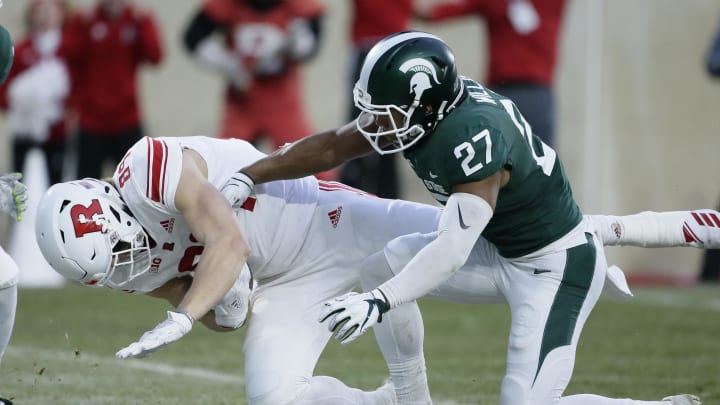 EAST LANSING, MI – NOVEMBER 24: Tight end Travis Vokolek #89 of the Rutgers Scarlet Knights scores past safety Khari Willis #27 of the Michigan State Spartans on a pass play during the first quarter at Spartan Stadium on November 24, 2018 in East Lansing, Michigan. (Photo by Duane Burleson/Getty Images)