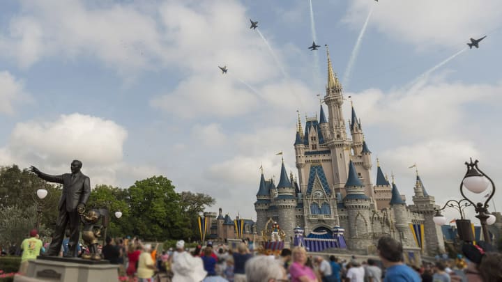 LAKE BUENA VISTA, FL – MARCH 19: In this handout photo provided by Disney Parks, in a special moment for Magic Kingdom guests, the U.S. Navy Flight Demonstration Squadron, the Blue Angels, streaked across the skies above, Cinderella Castle (Photo by Mariah Wild/Disney Parks via Getty Images)