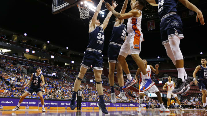 SUNRISE, FLORIDA – DECEMBER 21: Keyontae Johnson #11 of the Florida Gators shot is blocked by Trevin Dorius #32 of the Utah State Aggies during the first half of the Orange Bowl Basketball Classic at BB&T Center on December 21, 2019 in Sunrise, Florida. (Photo by Michael Reaves/Getty Images)