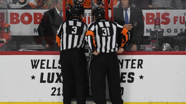 PHILADELPHIA, PA - FEBRUARY 22: Referee Mike Leggo (3) and referee Trevor Hanson (31) check the replay during a National Hockey League game between the Washington Capitals and the Philadelphia Flyers on February 22, 2017 at Wells Fargo Center in Philadelphia, PA. (Photo by Andy Lewis/Icon Sportswire via Getty Images)