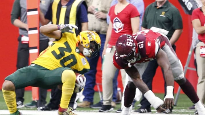 SAN ANTONIO, TX - MARCH 31: Justin Stockton #30 of the Arizona Hotshots tries to avoid the tackle of Darnell Leslie #51 of the San Antonio Commanders at Alamodome on March 31, 2019 in San Antonio, Texas. (Photo by Ronald Cortes//Getty Images)