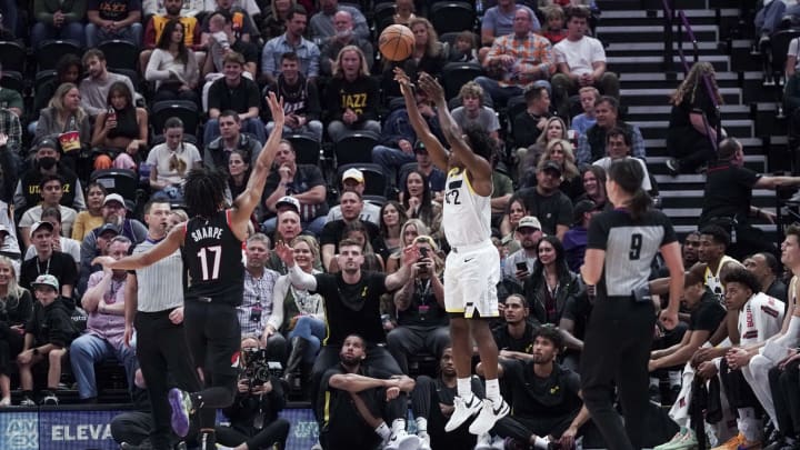 Oct 14, 2023; Salt Lake City, Utah, USA; Utah Jazz point guard Collin Sexton (2) shoots from the three point line over Portland Trail Blazers guard Shaedon Sharpe (17) in the second quarter at Delta Center. Mandatory Credit: Gabriel Mayberry-USA TODAY Sports