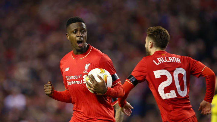 LIVERPOOL, ENGLAND – APRIL 14: Divock Origi (L) of Liverpool celebrates scoring his team’s opening goal with Adam Lallana during the UEFA Europa League quarter final, second leg match between Liverpool and Borussia Dortmund at Anfield on April 14, 2016 in Liverpool, United Kingdom. (Photo by Clive Brunskill/Getty Images)