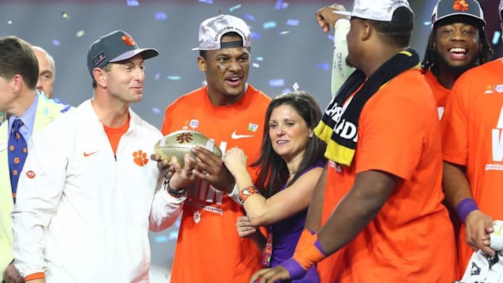 December 31, 2016; Glendale, AZ, USA; Clemson Tigers head coach Dabo Swinney and quarterback Deshaun Watson (4) celebrate the 31-0 victory against the Ohio State Buckeyes following the the 2016 CFP semifinal at University of Phoenix Stadium. Mandatory Credit: Mark J. Rebilas-USA TODAY Sports
