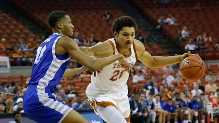AUSTIN, TX - NOVEMBER 6: Jericho Sims #20 of the Texas Longhorns drives around Cam Burrell #10 of the Eastern Illinois Panthers at the Frank Erwin Center on November 6, 2018 in Austin, Texas. (Photo by Chris Covatta/Getty Images)
