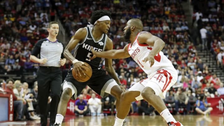 HOUSTON, TX - MARCH 30: De'Aaron Fox #5 of the Sacramento Kings dribbles the ball defended by Chris Paul #3 of the Houston Rockets in the third quarter at Toyota Center on March 30, 2019 in Houston, Texas. NOTE TO USER: User expressly acknowledges and agrees that, by downloading and or using this photograph, User is consenting to the terms and conditions of the Getty Images License Agreement. (Photo by Tim Warner/Getty Images)