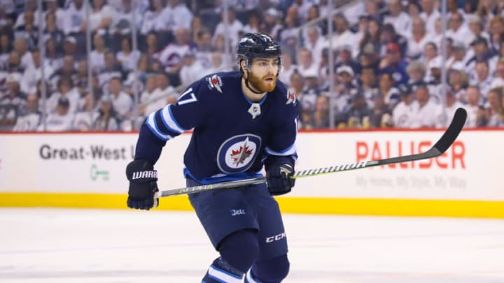 WINNIPEG, MB - MAY 14: Adam Lowry #17 of the Winnipeg Jets follows the play down the ice during first period action against the Vegas Golden Knights in Game Two of the Western Conference Final during the 2018 NHL Stanley Cup Playoffs at the Bell MTS Place on May 14, 2018 in Winnipeg, Manitoba, Canada. The Knights defeated the Jets 3-1 to tie the series 1-1. (Photo by Darcy Finley/NHLI via Getty Images)