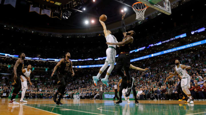 May 27, 2018; Boston, MA, USA; Boston Celtics forward Jayson Tatum (0) dunks and scores against Cleveland Cavaliers forward LeBron James (23) during the fourth quarter in game seven of the Eastern conference finals of the 2018 NBA Playoffs at TD Garden. Mandatory Credit: David Butler II-USA TODAY Sports