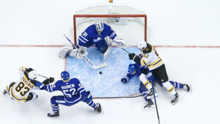 TORONTO, ON - OCTOBER 19: Toronto Maple Leafs defenseman Martin Marincin #52 battles for position against Boston Bruins center Karson Kuhlman #83 in front of Frederik Andersen during the third period at the Scotiabank Arena on October 19, 2019 in Toronto, Ontario, Canada. (Photo by Kevin Sousa/NHLI via Getty Images)