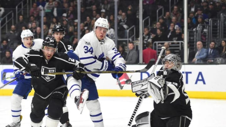 Auston Matthews #34 of the Toronto Maple Leafs attempts a deflection on Jonathan Quick #32 of the Los Angeles Kings as Alec Martinez #27 defends. (Photo by Harry How/Getty Images)