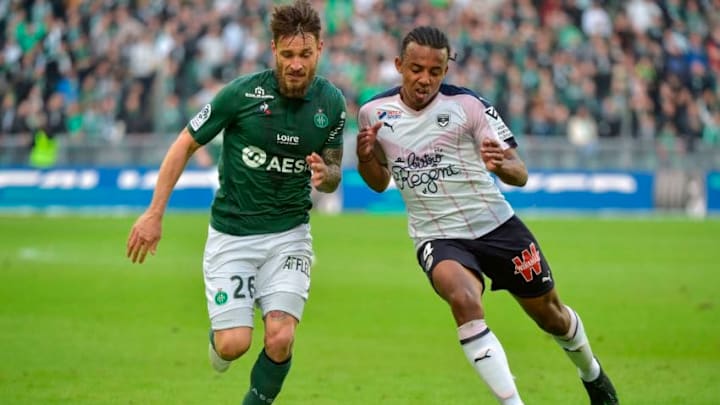 Saint-Etienne's French defender Mathieu Debuchy (L) vies with Saint-Etienne's French defender William Saliba (R) during the French L1 football match between Saint-Etienne (ASSE) and Bordeaux (FCB) on April 14, 2019, at the Geoffroy Guichard Stadium in Saint-Etienne, central-eastern France. (Photo by ROMAIN LAFABREGUE / AFP) (Photo credit should read ROMAIN LAFABREGUE/AFP/Getty Images)