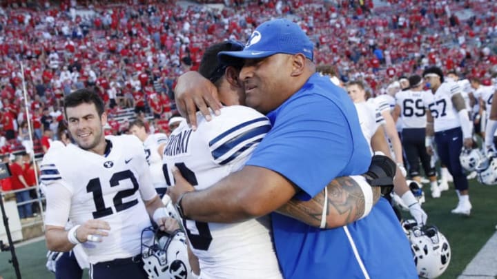 MADISON, WI - SEPTEMBER 15: Head coach Kalani Sitake of the BYU Cougars celebrates with Sione Takitaki #16 after the game against the Wisconsin Badgers at Camp Randall Stadium on September 15, 2018 in Madison, Wisconsin. BYU won 24-21. (Photo by Joe Robbins/Getty Images)