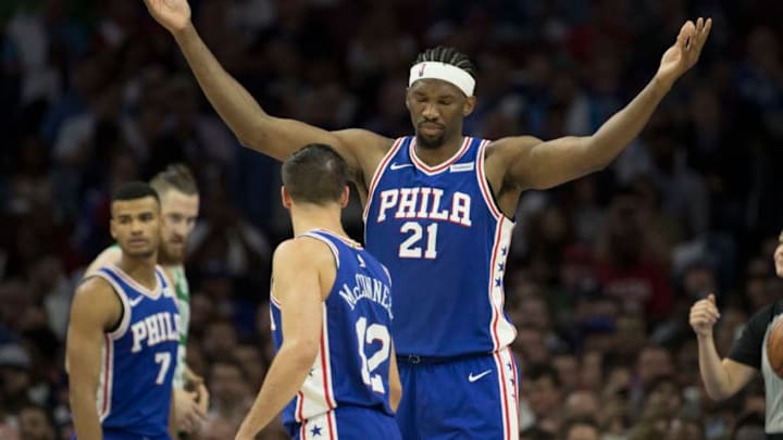PHILADELPHIA, PA - OCTOBER 20: Joel Embiid #21 and T.J. McConnell #12 of the Philadelphia 76ers react against the Boston Celtics at the Wells Fargo Center on October 20, 2017 in Philadelphia, Pennsylvania. (Photo by Mitchell Leff/Getty Images)