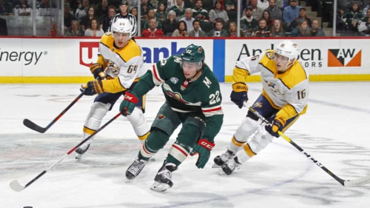 ST. PAUL, MN - MARCH 25: Kevin Fiala #22 of the Minnesota Wild controls the puck as Mikael Granlund #64 of the Nashville Predators and Rem Pitlick #16 of the Nashville Predators give chase during a game at Xcel Energy Center on March 25, 2019 in St. Paul, Minnesota. (Photo by Bruce Kluckhohn/NHLI via Getty Images)