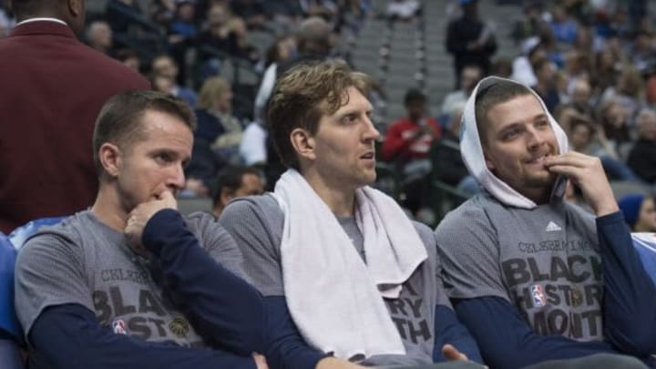 Feb 5, 2016; Dallas, TX, USA; Dallas Mavericks guard J.J. Barea (left) and forward Dirk Nowitzki (middle) and forward Chandler Parsons (right) sit on the bench during the second half of the game against the San Antonio Spurs at the American Airlines Center. The Spurs defeat the Mavericks 116-90. Mandatory Credit: Jerome Miron-USA TODAY Sports