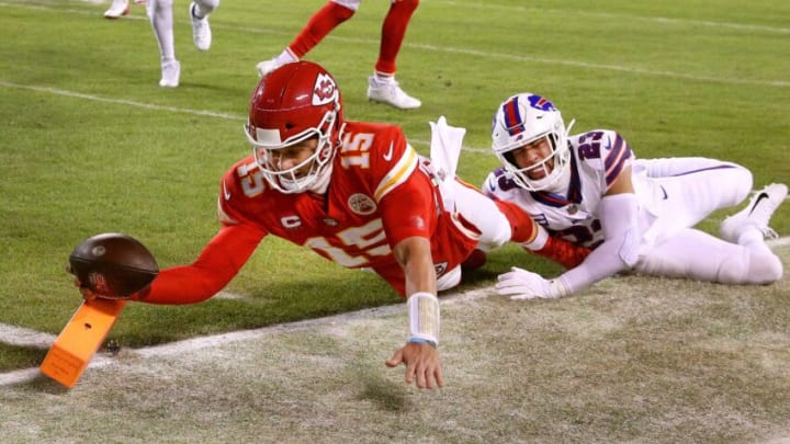 Chiefs quarterback Patrick Mahomes dives into the end zone for an 8-yard touchdown against the Bills Micah Hyde. The Chiefs won 42-36 in overtime.Ag3i5513