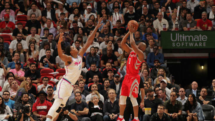 MIAMI, FL - FEBRUARY 7: Chris Paul #3 of the Houston Rockets shoots the ball against Hassan Whiteside #21 of the Miami Heat on February 7, 2018 at American Airlines Arena in Miami, Florida. NOTE TO USER: User expressly acknowledges and agrees that, by downloading and or using this Photograph, user is consenting to the terms and conditions of the Getty Images License Agreement. Mandatory Copyright Notice: Copyright 2018 NBAE (Photo by Oscar Baldizon/NBAE via Getty Images)