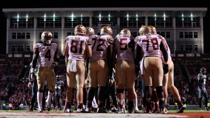 RALEIGH, NC - NOVEMBER 05: The Florida State Seminoles huddle up during their game against the North Carolina State Wolfpack at Carter-Finley Stadium on November 5, 2016 in Raleigh, North Carolina. (Photo by Mike Comer/Getty Images)