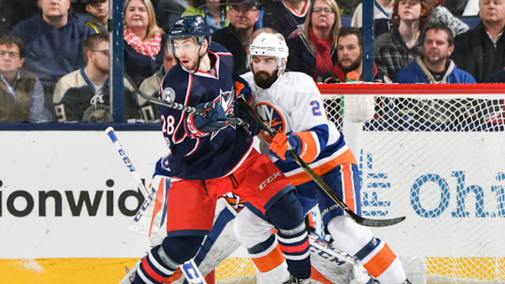 COLUMBUS, OH - FEBRUARY 25: Oliver Bjorkstrand #28 of the Columbus Blue Jackets and Nick Leddy #2 of the New York Islanders battle for position on February 25, 2017 at Nationwide Arena in Columbus, Ohio. (Photo by Jamie Sabau/NHLI via Getty Images)